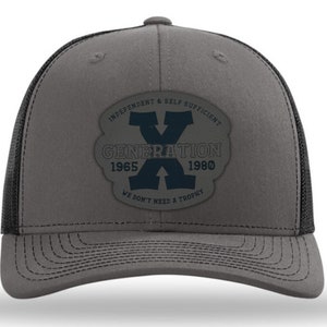 May include: A gray and black trucker hat with a black patch that says "Independent & Self Sufficient Generation X 1965-1980 We Don't Need A Trophy"