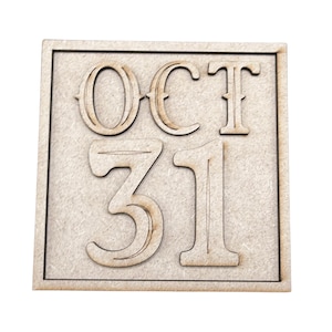 May include: A square light brown wooden sign featuring the text OCT 31 in raised, dark-edged lettering. The letters and numbers are centered on a flat, textured wooden surface framed by a thin, raised border, creating a dimensional appearance.