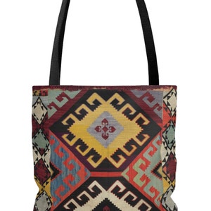 May include: A tote bag with a colorful geometric pattern inspired by traditional Turkish rugs. The pattern features a mix of red, blue, yellow, and white colors.