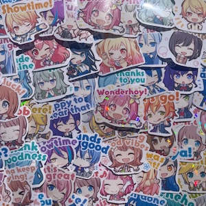 May include: A collection of colorful anime-style stickers featuring various characters with different hairstyles and outfits. Some stickers have text like "Showtime!" and "Wonderhoy!" The stickers are in various colors, including pink, blue, and yellow.