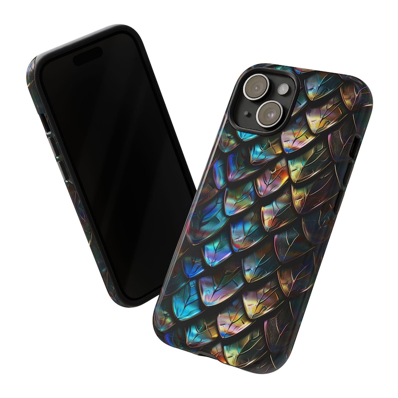 May include: A smartphone case featuring a repeating iridescent scale pattern in shades of blue, purple, gold, and black. The design covers the back of the device, wrapping around the edges, with a circular cutout for the camera lens array.