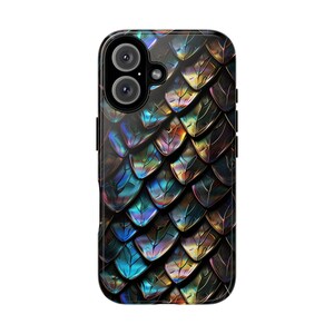 May include: A rectangular smartphone case featuring a repeating pattern of iridescent, overlapping scales in shades of deep blue, metallic gold, and dark purple. The design covers the entire back surface, including the camera lens cutout area.