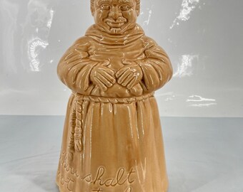 Tarro de cerámica vintage Cumberland Ware Pottery con forma de monje y la inscripción "No robarás".