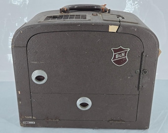 Proyector B&H Bell Howell de 16 mm Filmosound 185 B y altavoz Filmosound de la década de 1940.