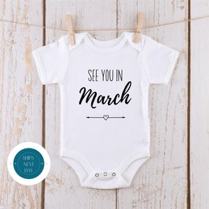See You in March Baby Reveal Onesie® | Custom Month Baby Annoucement Onesie® | Baby Shower Gift | New Baby