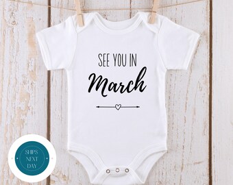 See You in March Baby Reveal Onesie® | Custom Month Baby Annoucement Onesie® | Baby Shower Gift | New Baby