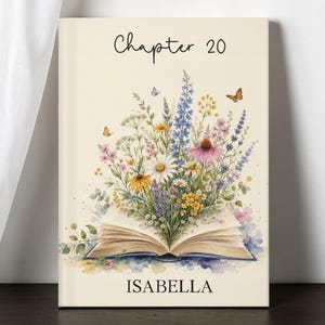 May include: A rectangular print on a cream background featuring an open book with a vibrant bouquet of wildflowers emerging from the pages. The text "Chapter 20" appears at the top, and the name "ISABELLA" is printed in black at the bottom.
