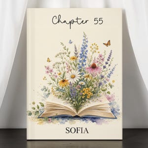 May include: A book cover with the text "Chapter 55" and the name "SOFIA". The cover features an open book with a watercolor illustration of colorful wildflowers and butterflies. The background is a soft cream color.