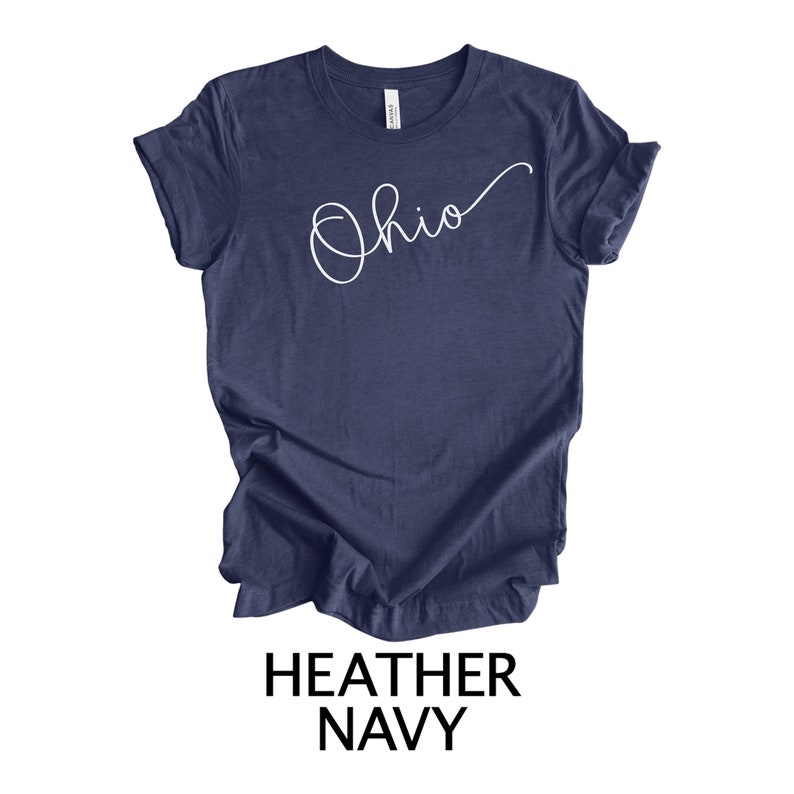 May include: A heather navy blue t-shirt with the word "Ohio" written in white cursive script.