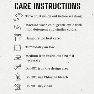 May include: A black and white illustration of care instructions for a shirt. The instructions include turning the shirt inside out before washing, machine washing cold, gentle cycle with mild detergent and similar colors, hang-drying, tumble-drying on low, ironing inside-out only if necessary, not ironing the design area, not using chlorine bleach, and not dry cleaning.