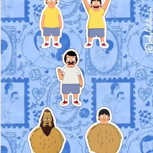 Peut inclure: Un fond bleu avec des autocollants de personnages de dessins animés. Les autocollants présentent des personnages dans différentes poses, portant des chemises jaunes et des shorts bleus. Le fond a un motif répétitif de cadres bleus et d'éléments décoratifs.