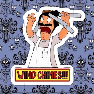 May include: A sticker featuring a cartoon character with a black mustache, wearing a white apron over a light shirt, holding silver wind chimes above their head. Below the character is a yellow rectangular sign with the red text WIND CHIMES!!!