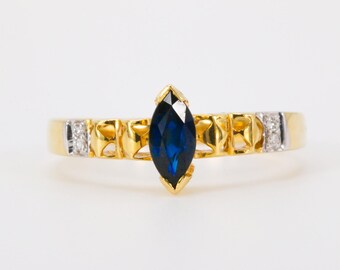 Marquise Cut Sapphire & Round Brilliant Diamonds in 18k Yellow Gold Ring