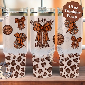 May include: A 40 ounce tumbler wrap with a leopard print design. The wrap features a basketball, a bow, and the text "Basketball Mom".