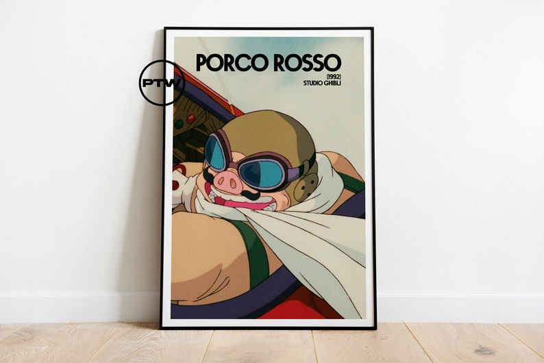 May include: A poster featuring a cartoon pig wearing goggles and a scarf, flying a red plane. The poster has the title "Porco Rosso" and the text "1992 Studio Ghibli".