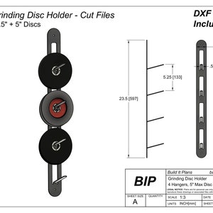 May include: A black metal grinding disc holder with four hangers for storing 5-inch grinding discs. The holder is 23.5 inches tall and has a 5-inch wide base. The text "Build It Plans" and "Grinding Disc Holder" is printed on the bottom of the holder.