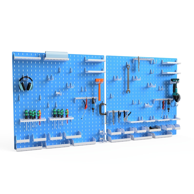 May include: A blue pegboard wall organiser with various tools and accessories, including a drill, a wrench, a hammer, and a pair of headphones. The pegboard has white shelves and white bins for storage.