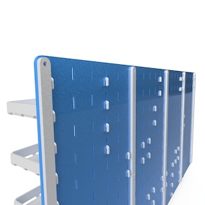 May include: A blue pegboard wall organiser with three shelves. The pegboard has a grid of holes for hanging tools and other items. The shelves are made of white plastic and are attached to the pegboard with metal brackets.