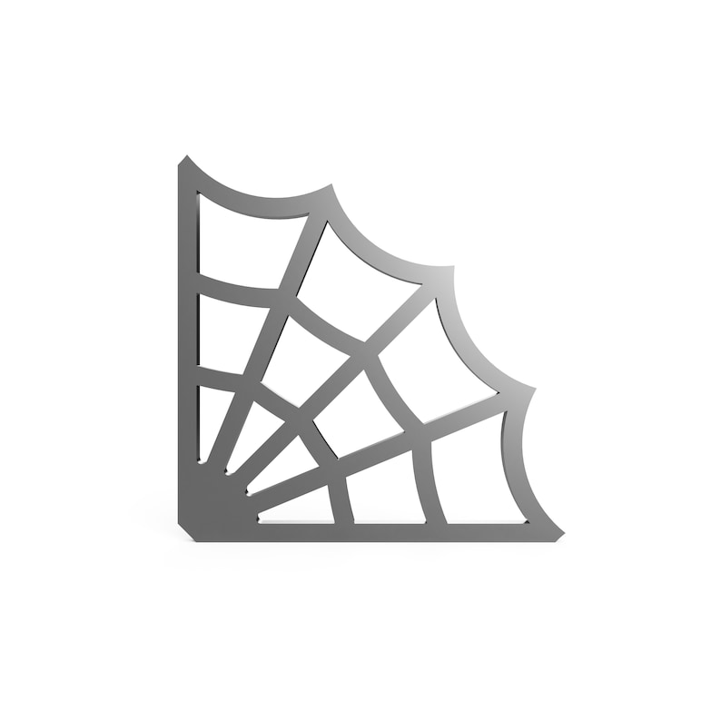 May include: A silver-colored metal corner shelf with a spiderweb design.