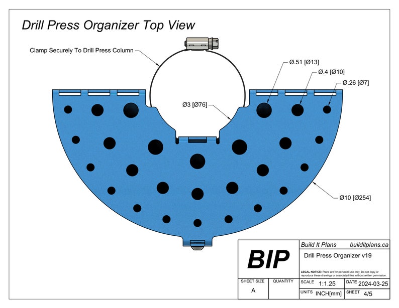 May include: Top view diagram of a blue drill press organizer. The design includes a semi-circular base with multiple circular holes, a central clamp, and dimensional callouts in inches and millimeters. Text includes "Drill Press Organizer Top View" and "Build It Plans".