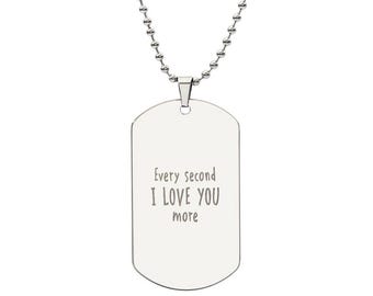 May include: Silver dog tag necklace with a silver chain. The dog tag has the inscription "Every second I love you more".