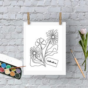 May include: A white print of line art flowers with the text "walk with me" on a tag. The artwork is hanging on a clothesline with wooden clips. A watercolor paint set, a paintbrush, and tulips are also in the image.
