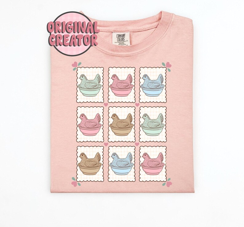 May include: A light pink crew neck sweatshirt with a repeating pattern of chicken illustrations in pastel colors. Each chicken is in a bowl, framed by a postage stamp design. The text "ORIGINAL CREATOR" is in a pink circle.