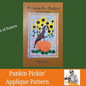 May include: A brown and white dog sits atop an orange pumpkin, surrounded by sunflowers, on a fabric panel. The text "Trouble & Boo Designs" and "Punkin Pickin'" are displayed. The words "Front of Pattern" and "Punkin Pickin' Applique Pattern" are also visible.