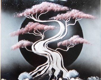 May include: A black and white spray paint artwork depicting a stylized tree with pink blossoms, a waterfall, and a moon. The tree is in the center of the image and its branches are curved and twisted. The waterfall is flowing down from the base of the tree and into a pool of water. The moon is in the background and is partially obscured by the tree.
