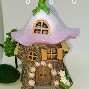 Fairy garden petal house with fairy for fairy gardens great for imagination and pretend play. Cute kids. Great gifts. Stunning colours.