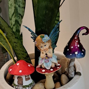 Garden fairy stake with metallic toadstool stake and toadstool fairy house. For fairy gardens great for imagination and pretend play.