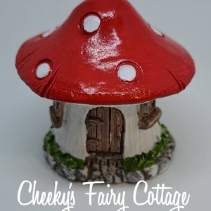 Toadstool fairy house for gardens great for imagination and pretend play. Cute kids. Great gifts. Stunning colours.