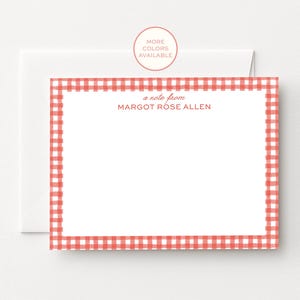 May include: A rectangular white stationery card featuring a red and white gingham border. The text "a note from MARGOT ROSE ALLEN" is printed in red at the top centre. A matching white envelope is positioned directly behind the stationery card.