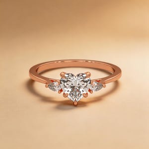 Round diamond ring in rose gold with pave band