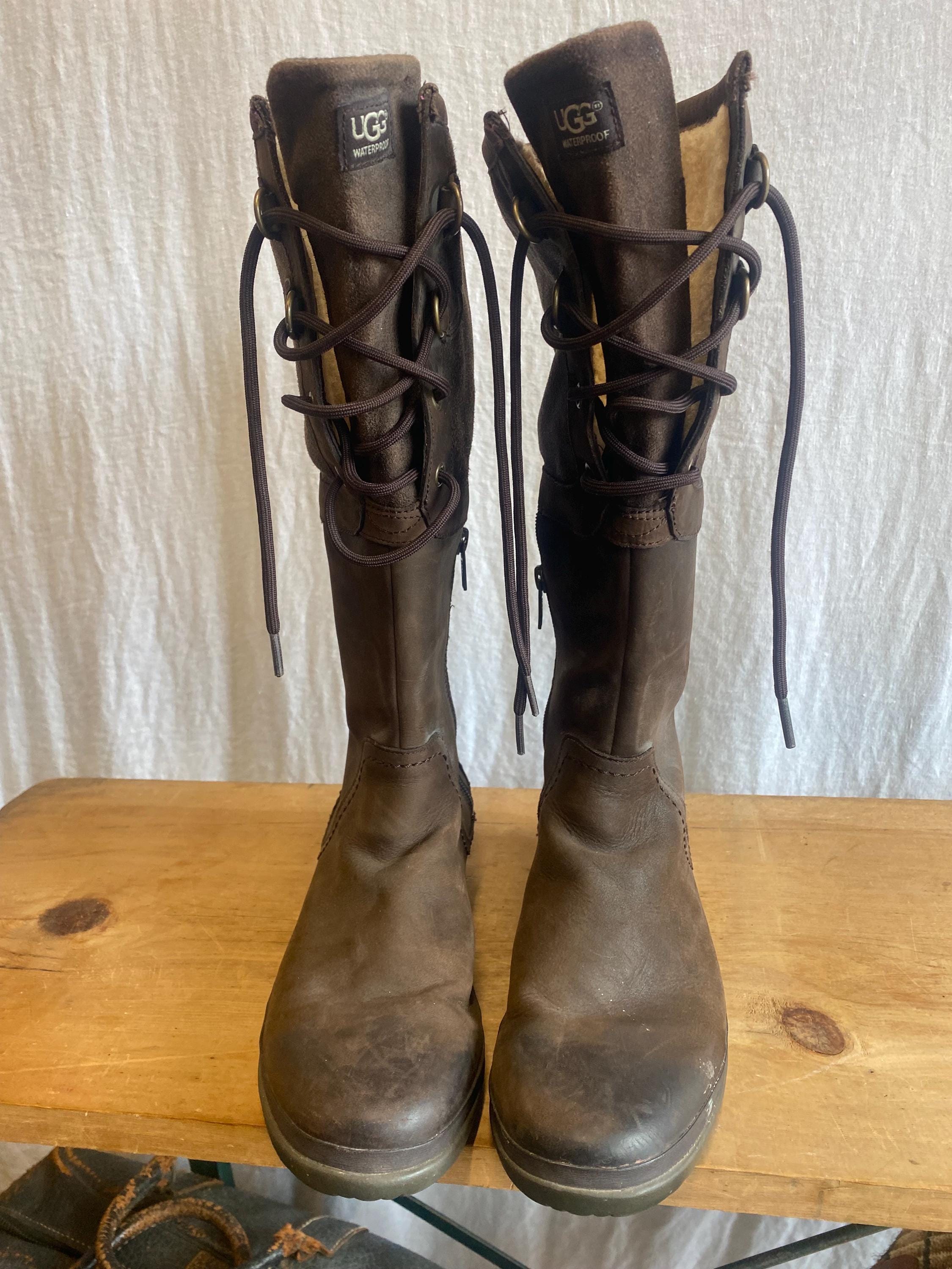 Knee high, dark brown leather UGG brand boots, lined with extra thin Shearling wool. sz. 8. Excellent condition!