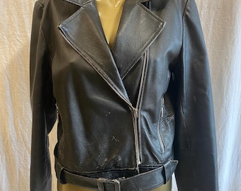 Black leather jacket, 1990’s vintage, feminine, naturally distressed, grunge, rocker, biker style.
