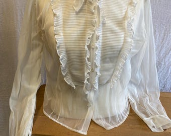 beautiful 1940’s or 50’s sheer white blouse with ruffled front. Tags have been removed, but measurements reflect a sz. Large