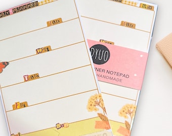 May include: Two weekly planner notepad sets with floral designs. The top of each notepad says "Weekly Planner" and the days of the week are labeled on each page. The bottom of the notepad says "Reminders/Notes".