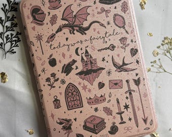 May include: A pink rectangular case with a fairytale theme. The case features illustrations of a dragon, castle, sword, and other fantasy elements. The text "today was a fairytale" is also present.
