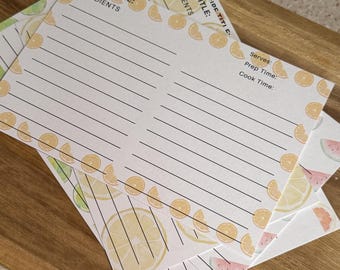 May include: Four white recipe cards with a lemon and watermelon design. The cards have lines for writing down a recipe title, ingredients, serves, prep time, and cook time.