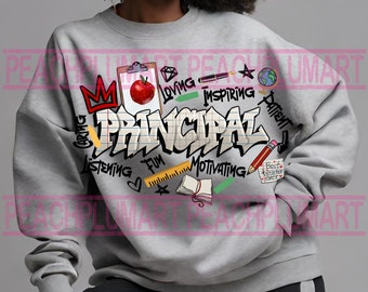 May include: Grey sweatshirt featuring a graphic design of the word "Principal" in graffiti style. The design includes a red apple, a crown, a ruler, a notebook, a pencil, and other school-related items. The words "Caring, Listening, Fun, Motivating, Loving, Inspiring, Patient" are also included in the design.
