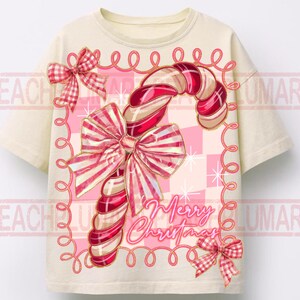 May include: Cream-colored t-shirt featuring a candy cane design with red and pink bows and the words "Merry Christmas." The candy cane has red and white stripes. The design is surrounded by a pink border.