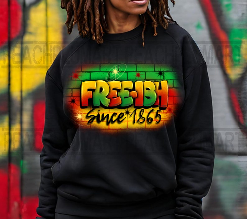 May include: Black sweatshirt with a graphic print of a brick wall with the words "FREE-ISH Since 1865" in green, red, and yellow.