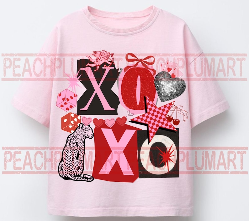 May include: A light pink t-shirt featuring a graphic print with the text XOXO, a leopard, a silver glitter heart, a red bow, a pink checkered star, dice, cherries, and a cupid. The design includes various red, pink, and black elements.