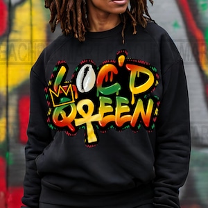 May include: Black sweatshirt with a colorful graphic design that says "Loc'd Queen" with a crown, an ankh symbol, and a cowrie shell.