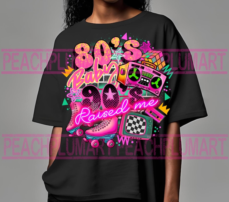 May include: Black t-shirt with a graphic design featuring a pink and blue roller skate, a boombox, a Rubik's cube, and the text "80's Baby 90's Raised Me".