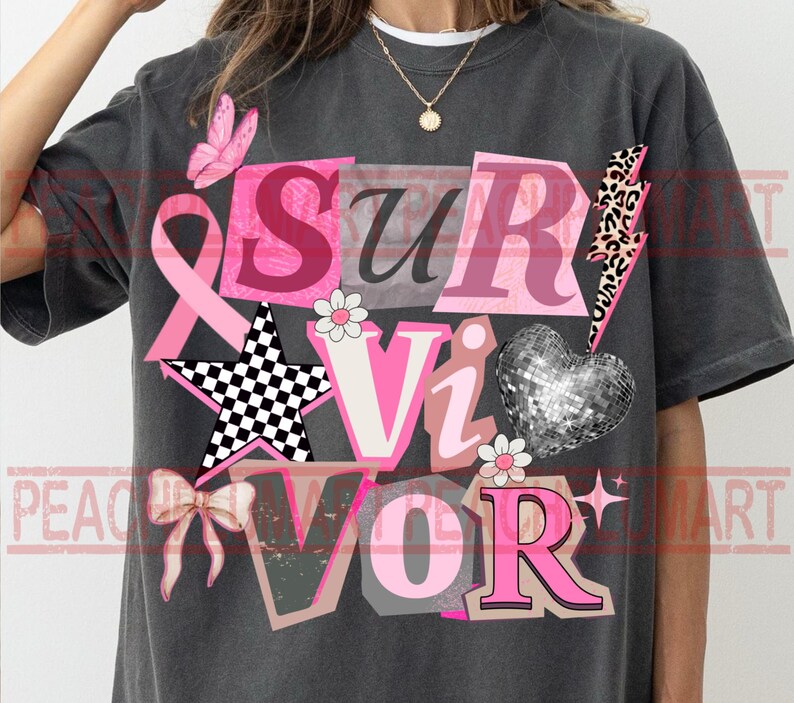 May include: Dark gray t-shirt with the word "Survivor" in pink, white, and black letters. The design includes a pink ribbon, a butterfly, a star, a bow, a disco ball heart, and a lightning bolt.