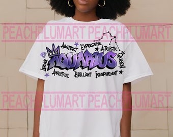 Könnte beinhalten: Weißes T-Shirt mit einem lila und blauen grafischen Design, das "Aquarius" im Graffiti-Stil zeigt. Das Design enthält auch eine Krone, einen Diamanten und Sterne. Die Wörter "Leader", "Abstract", "Expressive", "Artistic", "Analytical", "Brilliant", "Independent" und "Queen" sind um die Grafik herum geschrieben.