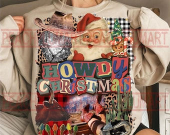 May include: A beige sweatshirt with a colorful graphic that says "HOWDY CHRISTMAS." The graphic includes a cowboy hat, Santa Claus, a disco ball, a gingerbread man, a bull, a cactus, and a belt buckle.