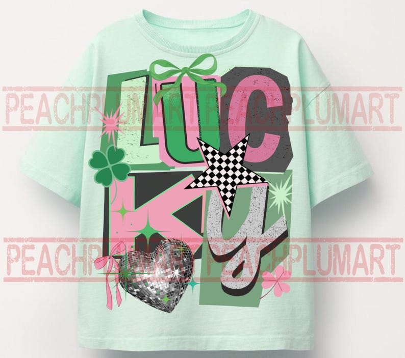 May include: A light green t-shirt with the word "LUCKY" in a colorful graphic design. The design includes a four-leaf clover, a disco ball heart, a star with a checkered pattern, and a green bow.